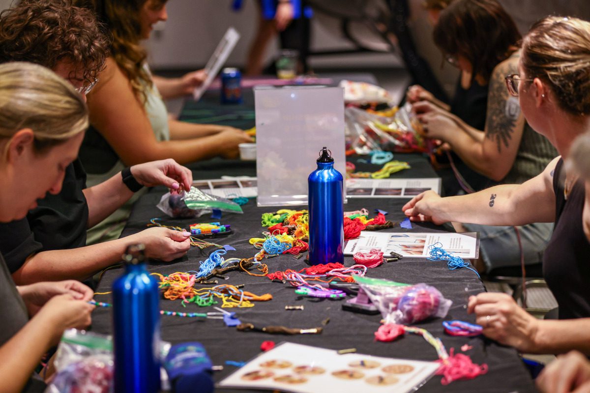 Women craft together at summer camp